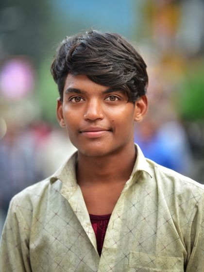 A simple, direct portrait of a young man with striking eyes. This kind of close up shot focuses entirely on the person's face and expression.