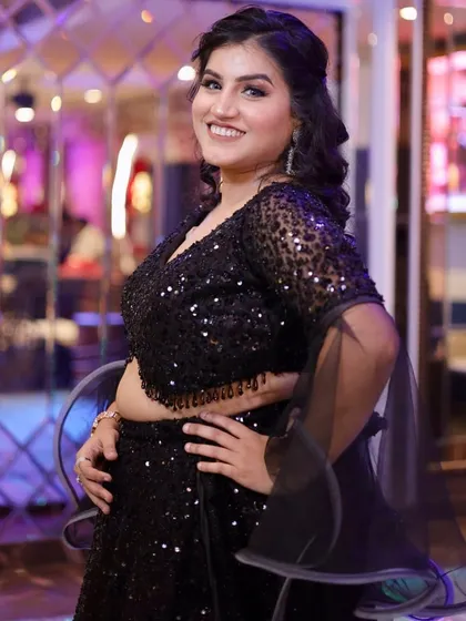 Another angle of this stunning black party look. The makeup is designed to be flawless from every angle.