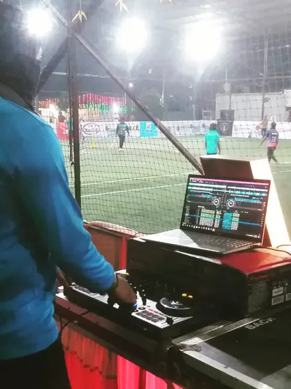 Bringing the beats to the sports field. Here I am DJing for a cricket tournament, keeping the energy high for the players and the crowd between matches.