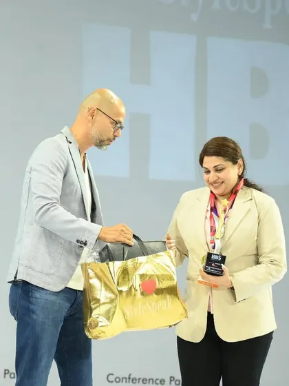 Receiving an award and prize at the HBS 2025 competition. This image showcases the prestige and recognition that comes with being part of the SoBo Nail Salon network.