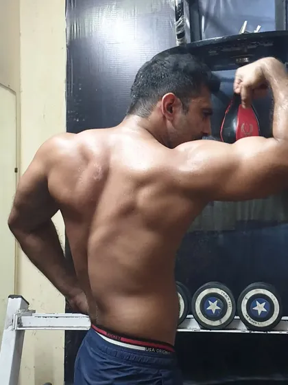Focusing on back and bicep definition. A strong back is crucial for posture and overall strength, and we target it with a variety of pulling exercises.