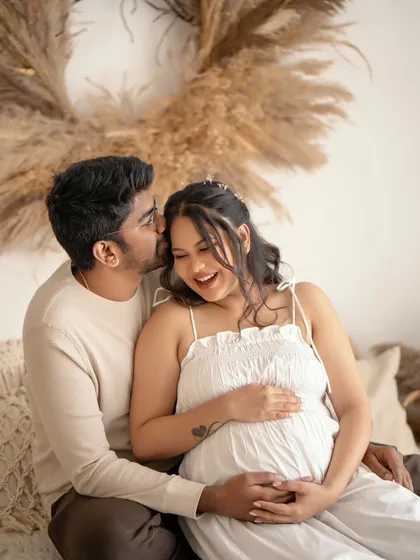 These are the moments that make my heart melt. The pure, unscripted joy between a couple as they anticipate their little one's arrival, captured in a warm, boho-inspired setting in my Bangalore studio.