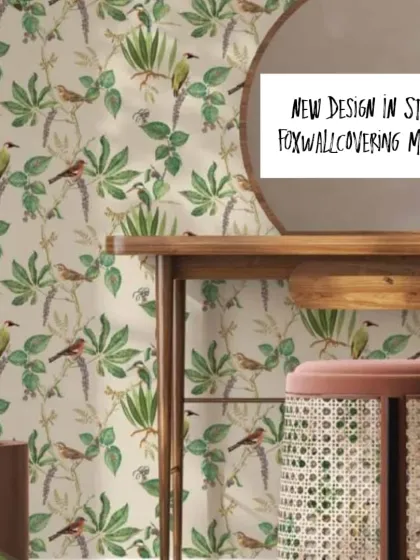 A delicate wallpaper pattern featuring small birds on leafy vines. This design is shown here in a light, neutral color, perfect for a calm and pretty space.