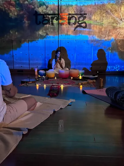 A closer look at the heart of our sound bath. Our practitioner uses a set of crystal singing bowls, each with a unique frequency, to create vibrations that help quiet the mind and restore balance. The candlelight and nature projections complete the tranquil vibe.