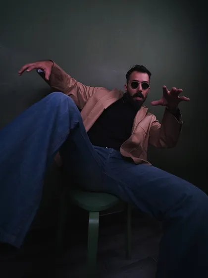 Bringing some dynamic energy to a seated pose. This kind of expressive movement works well for fashion shoots that need to feel alive and engaging.