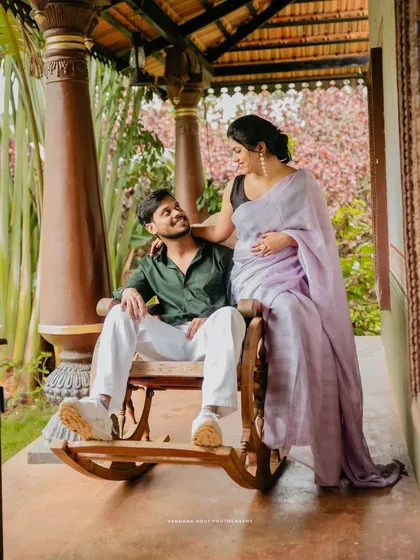 A quiet moment on a rocking chair at a heritage resort. This setting is perfect for capturing a relaxed and timeless pre-wedding photo, surrounded by greenery.