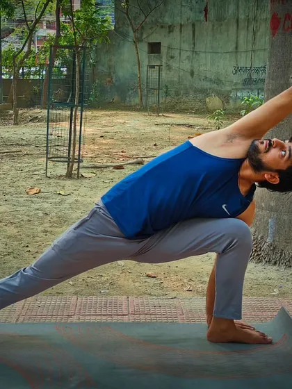 Here I am in Utthita Parsvakonasana, the Extended Side Angle Pose. This asana tones the ankles, knees, and thighs, and can provide relief in cases of sciatica and arthritis pain.