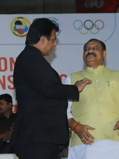 Pinning a badge on a dignitary at the KIO National Championship in Hyderabad. It is a gesture of respect and inclusion in our karate family.
