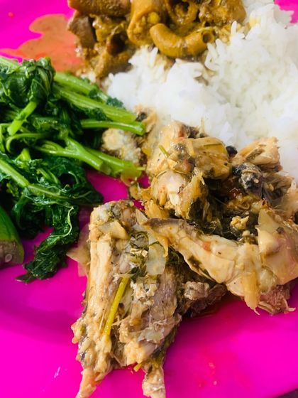 A simple thali with fish, beef innards, and boiled greens.