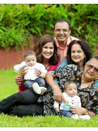 The whole family together. We love creating multi-generational portraits that include parents and grandparents, capturing the joy of the entire family welcoming its newest member in a beautiful outdoor setting.