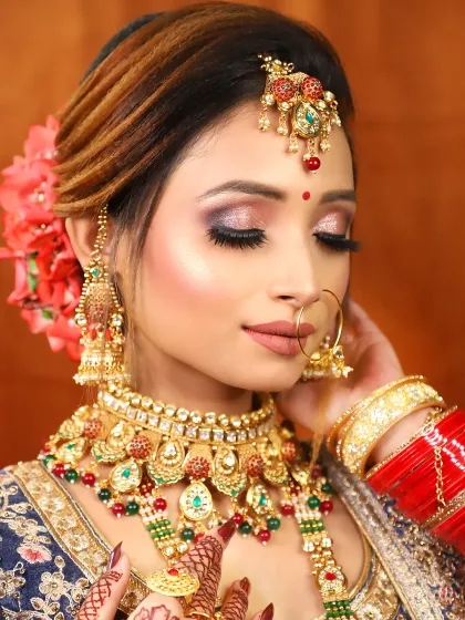 A close-up of a bride with her eyes closed, showing off the beautiful glittery eyeshadow work. This is a popular choice for high-glam brides.
