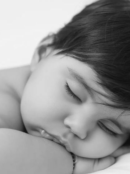 A peaceful black and white photo of a sleeping baby. These simple, unposed moments are just as beautiful and precious.