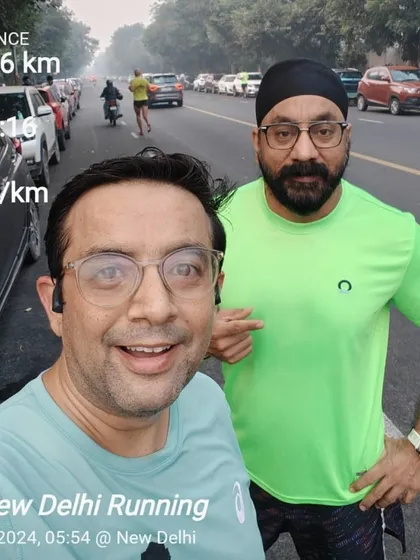 A selfie after a 10km run, with the stats to prove it. The accountability of running with a group helps us all stay on track.