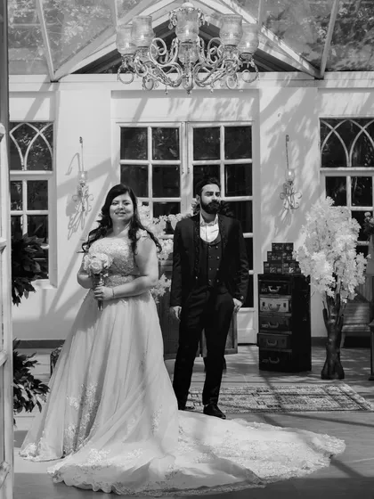 A classic black and white shot that adds a timeless, dramatic feel to the couple's portrait inside the glasshouse at Picture Villa.