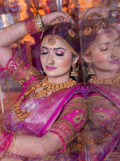 A reflective and artistic shot, showing the bride's makeup with her eyes closed. The shimmer on the eyelids is a key detail.