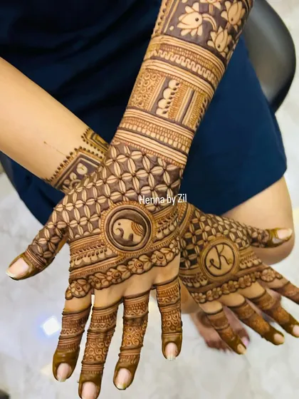 This design combines traditional floral patterns with personalized touches, including the couple's initials 'JK' and a cute elephant motif in the center of the palm.
