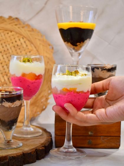 An assortment of my layered glass desserts, perfect for parties. Each glass is filled with different combinations of cake, cream, fruit, and chocolate.