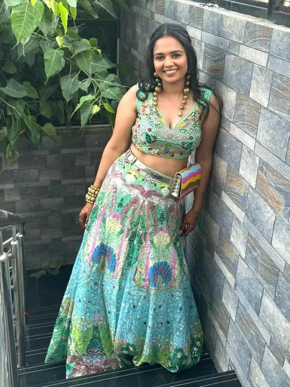 A fusion flair for the modern woman. This look is for someone who loves to break boundaries, pairing a unique, colorful lehenga with a fresh and subtle makeup look and soft, open curls.