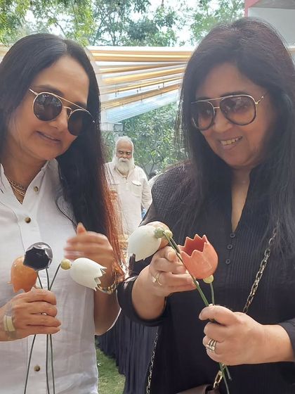 Two lovely customers picking out some of my lotus flower sticks at the Ahmedabad market. These are perfect for adding a permanent floral touch to a vase.