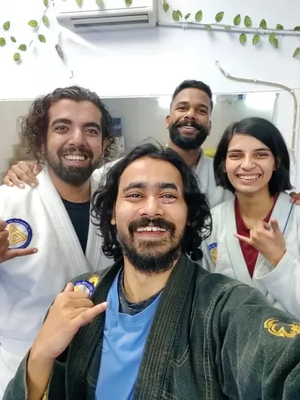A happy group in their white and black Gis, embodying the spirit of our BJJ Familia.