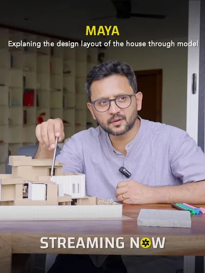 I find that explaining a design with a physical model really helps everyone get on the same page. Here, I'm walking through the layout for the 'Maya' residence, showing how the different spaces connect and flow.