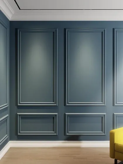 An example of classic wall moulding, or wainscoting, in a deep blue shade. This design element adds a touch of timeless elegance and architectural depth to any room.
