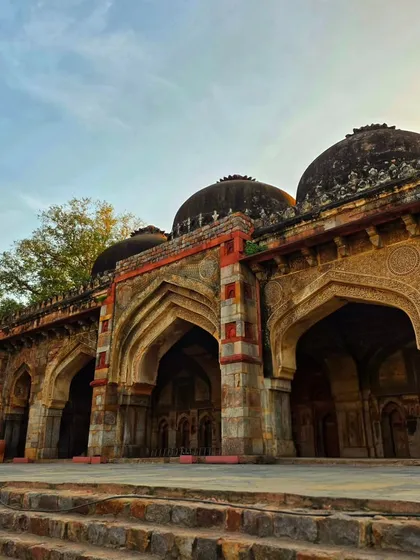 The beautiful arches of a monument in Lodi Garden, captured during the golden hour. The play of light and shadow highlights the intricate details of the architecture.