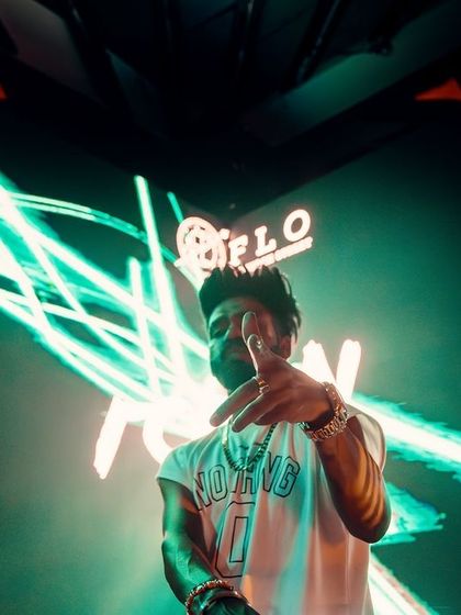 Engaging with the crowd directly from the DJ booth at FLO.