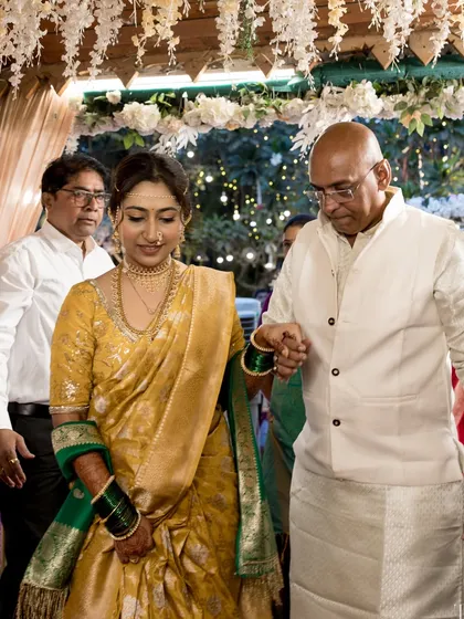 The bride being escorted by her father, a precious family moment.