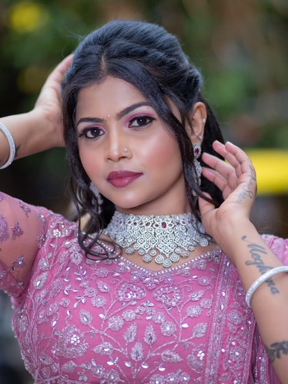 A close-up that highlights the flawless skin and the beautiful details of the jewellery.