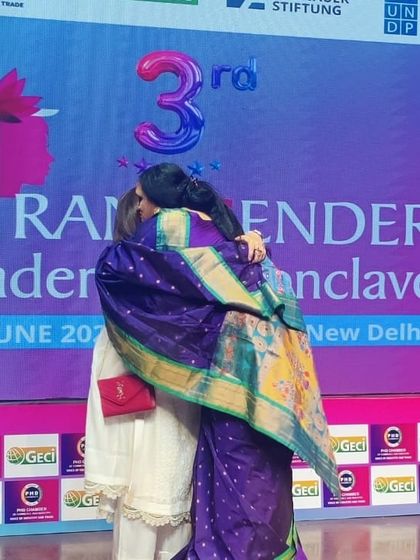 A warm hug shared on stage at the Transgender Leadership Conclave. These moments of connection and solidarity are what drive us.