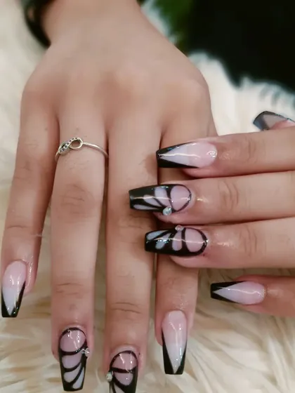 A full view of the creative butterfly wing nail art.