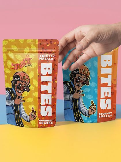 A hand holding two different flavor packets of the snack. This is a great way to show customers the variety available.