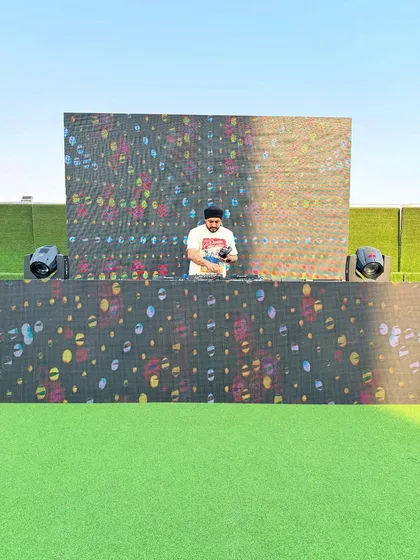 Getting the levels just right before the crowd arrives for the Holi celebration. The outdoor setting is perfect for a party like this.
