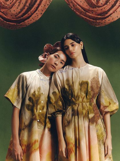 Models showcasing pieces from Cord's "SUMMER'24" collection. The artistic direction, featuring a custom green backdrop and draped fabric, reflects the brand's conscious and handmade aesthetic.