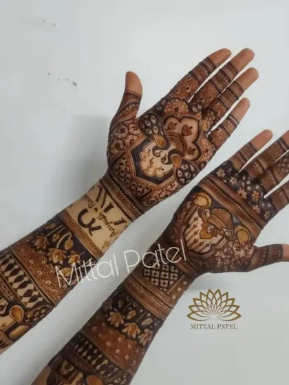 The back of a bridal design, showing the couple's initials and intricate traditional patterns.