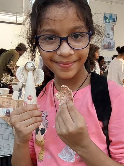 This young visitor to the Bengaluru Potter's Market chose one of my angel ornaments and a textured leaf charm. It's always a joy to see what pieces people connect with.