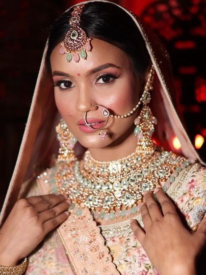 A close-up on the flawless bridal makeup and stunning jewelry that completes the look with my rental lehenga.