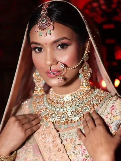 A close-up on the flawless bridal makeup and stunning jewelry that completes the look with my rental lehenga.