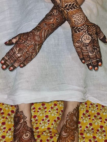 This client wanted her partner's name included in her design. I placed it inside a heart motif on the back of her hand, making it a special part of her full bridal look.