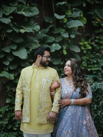 A classic wedding couple portrait, showcasing their elegant attire and happy smiles.