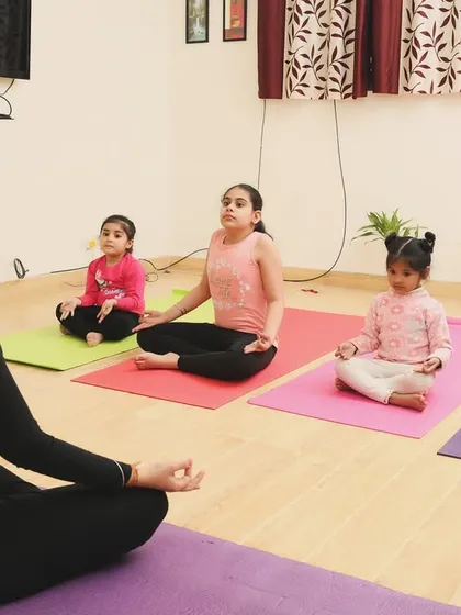 A moment of calm. I guide the children in simple meditation and breathing exercises to help them find their center. Learning to sit in stillness is a powerful tool for emotional regulation, even for the youngest minds.