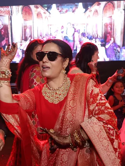 A moment of pure joy. Pooja Malik celebrates at her son's wedding, her handcrafted jewelry shining as brightly as her smile. This is what it means to wear pieces that feel truly special.