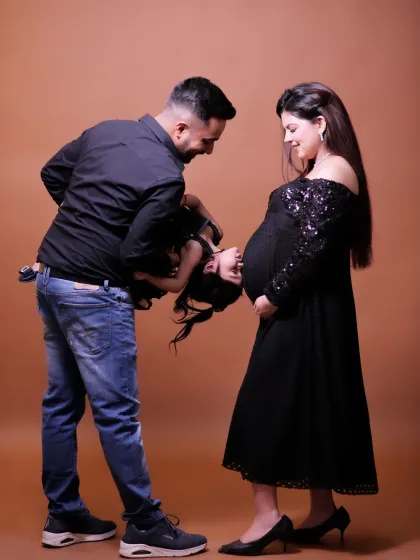 A maternity session is even more special when an older sibling is involved. This playful, candid moment captures the love and anticipation of the entire family as they wait to welcome their newest member.