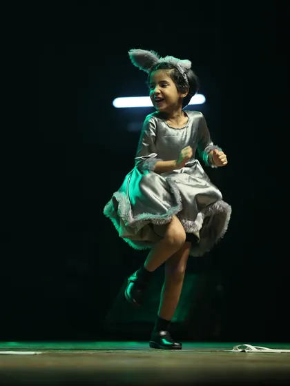 A throwback to a past showcase. The pure joy on this little performer's face is what our annual show is all about.