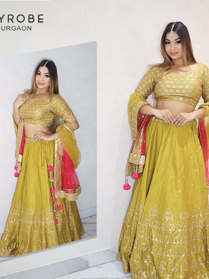 This lime green lehenga with a contrasting pink dupatta is a fresh and vibrant choice for a Mehendi or Haldi ceremony.