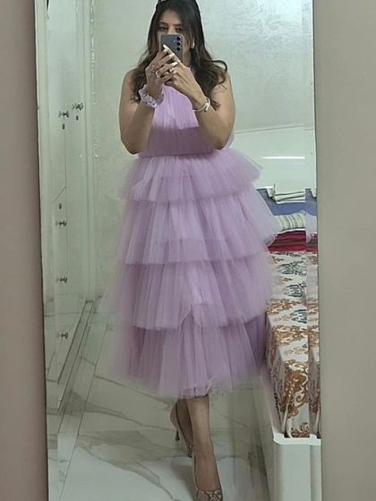 A client's mirror selfie showing off her custom-made lavender tiered tulle dress. It's always great to see clients feeling confident and happy in my designs.