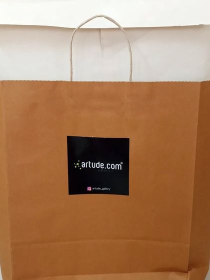 Every corporate gift is professionally packaged. Here is the pirate-themed caricature ready to be presented in our branded bag.