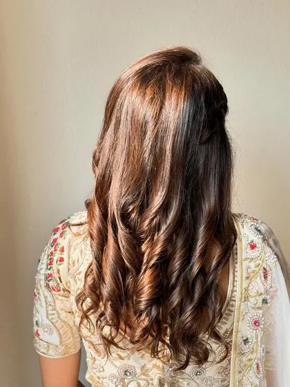 Soft curls for a soft girl look. This half-up style is simple, elegant, and timeless, perfect for any wedding guest.
