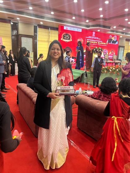 Holding the 'Durga' award I received at the International Women Summit. A proud moment for me and my foundation.